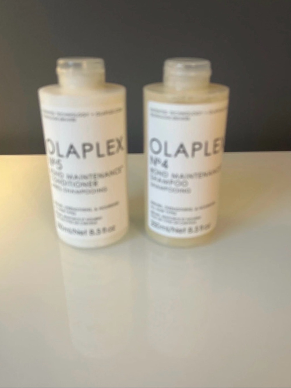 OLAPLEX White and Clear Travel-Size Hair Shampoo Bottles